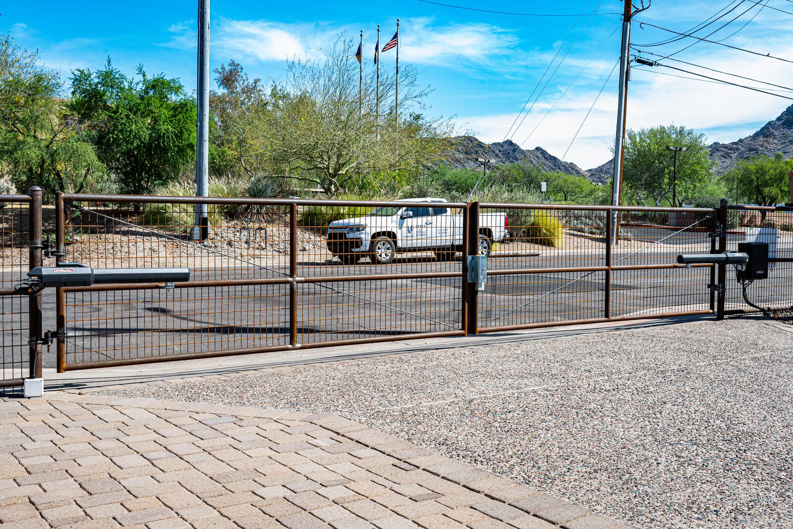Custom automated sliding steel gate at an industrial site in Arizona Custom automated sliding steel gate at an industrial site in Arizona