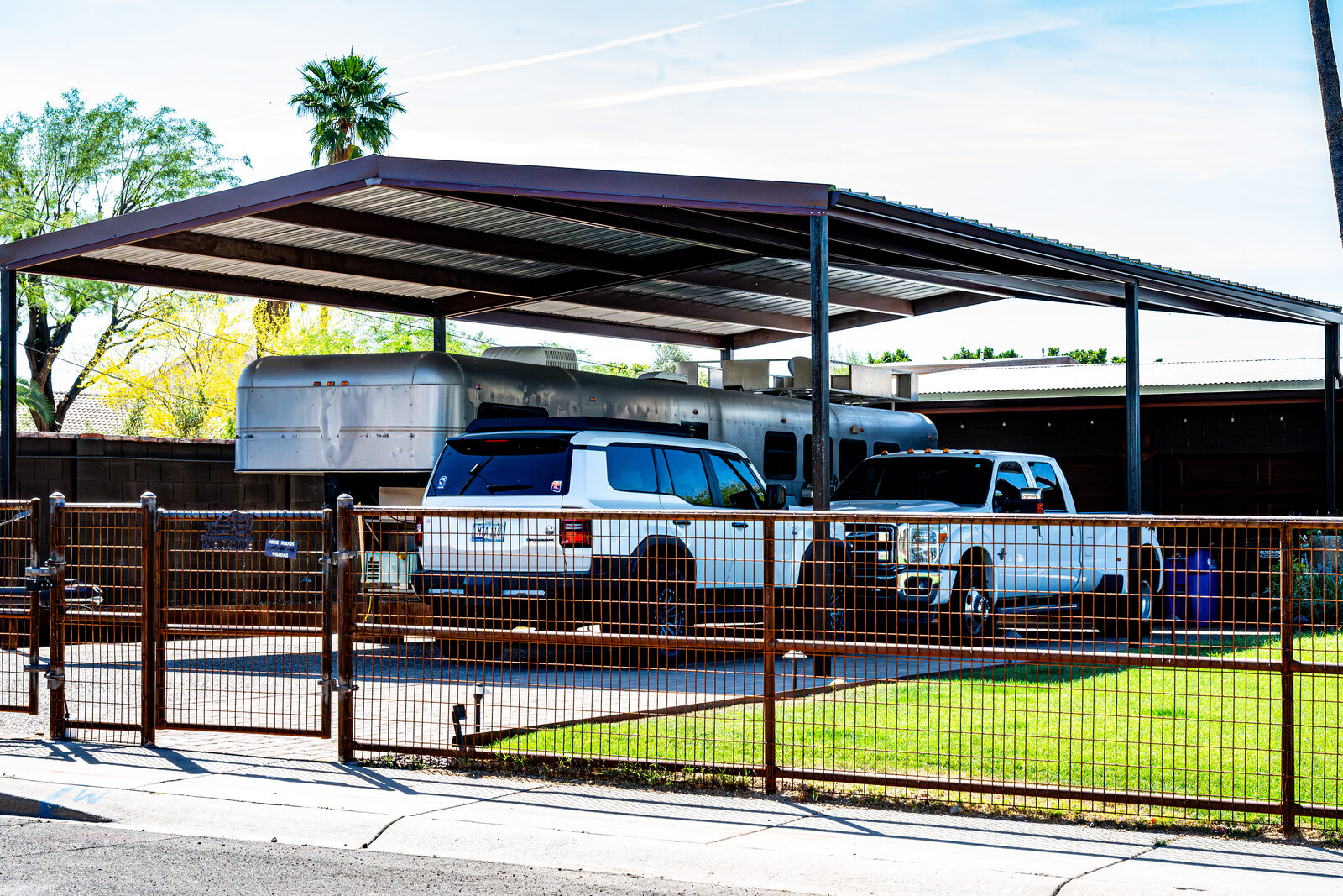 Welded pipe-and-rail fence on a property in Arizona
