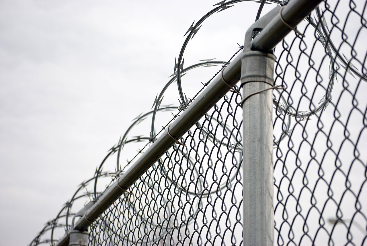 High-security perimeter fence with razor wire in Arizona