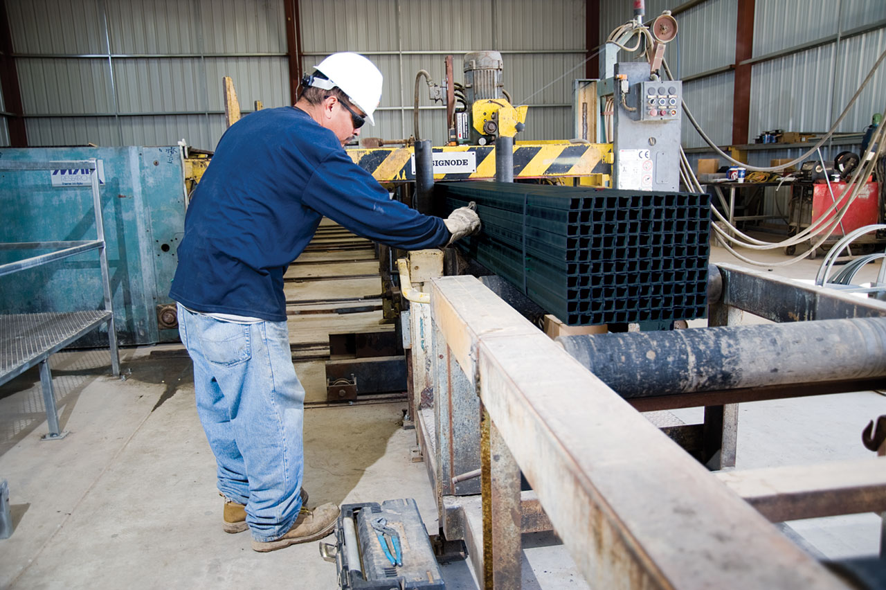 LP Steel worker bundling square tube on the production line, Arizona